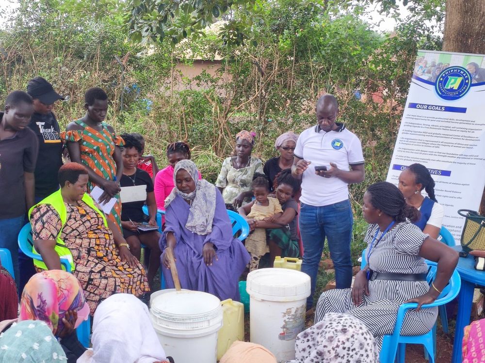 Women seated in a circle during a sensitisation session