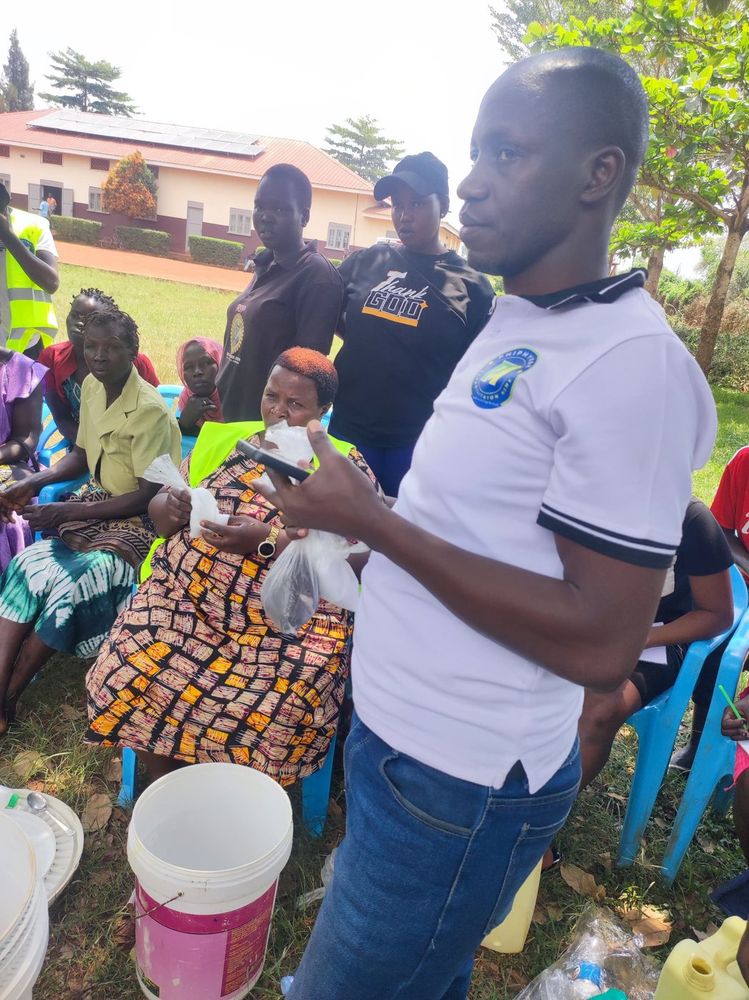 A team member holding a sample during the soap making demonstration