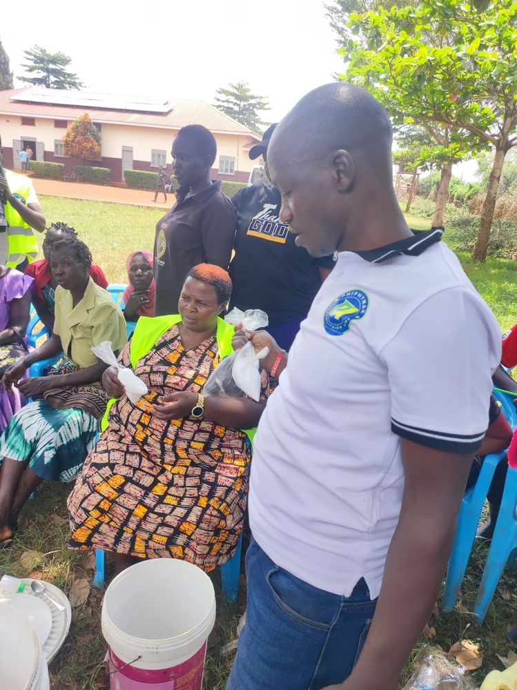 A team member explaining the soap making process to seated participants