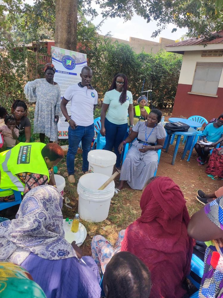 Participants seated around tables of supplies at the outreach venue