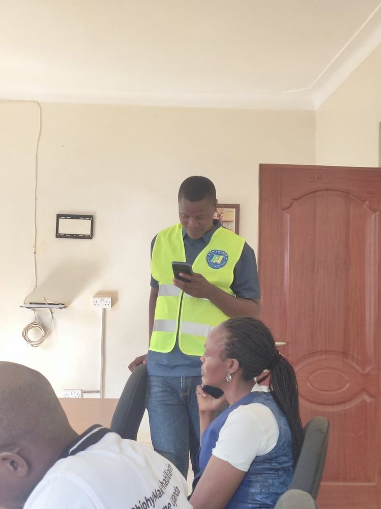 Two team members registering a participant indoors