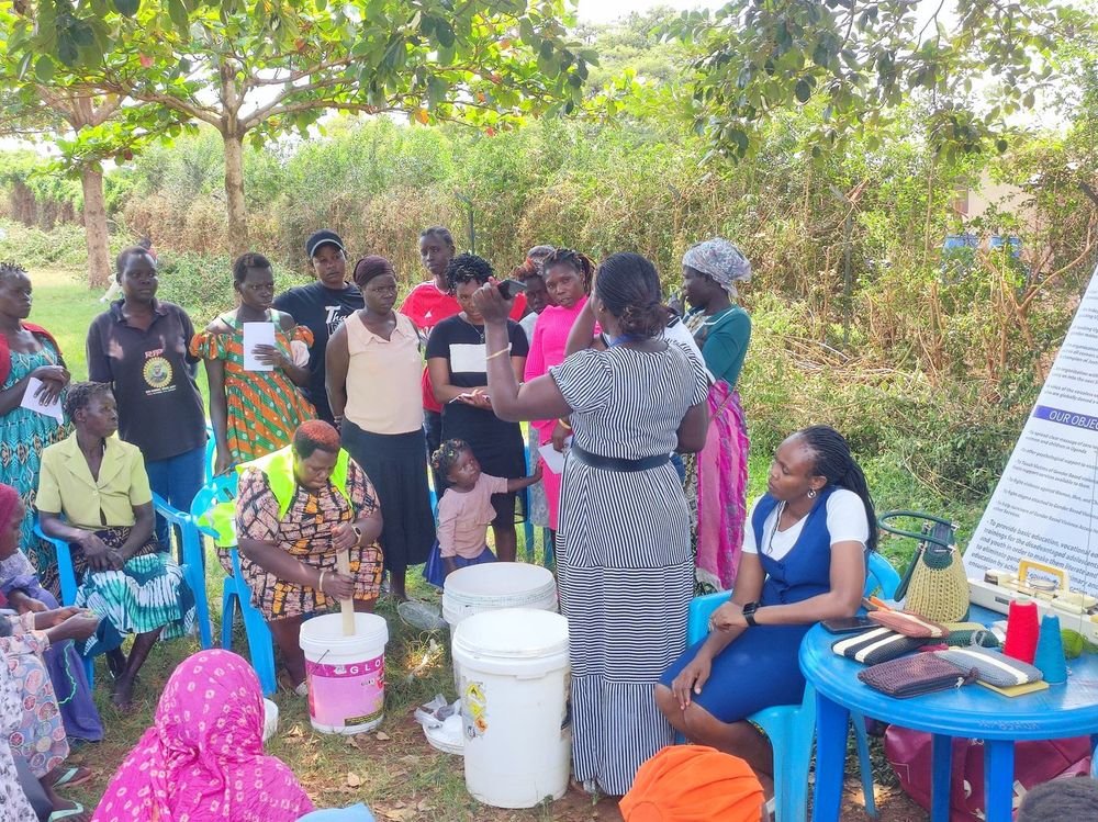 Participants queuing beside the tables of supplies