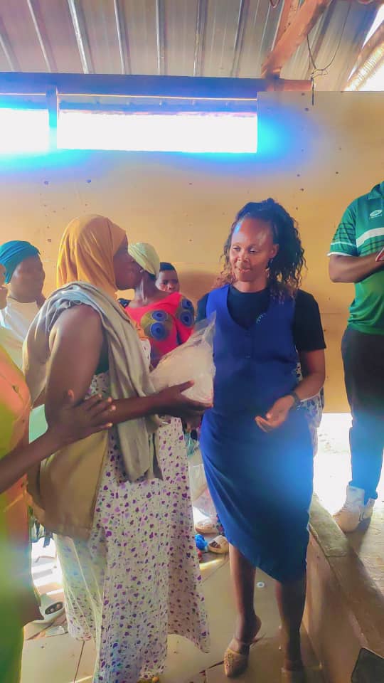 Mothers waiting to receive supplies inside the shelter