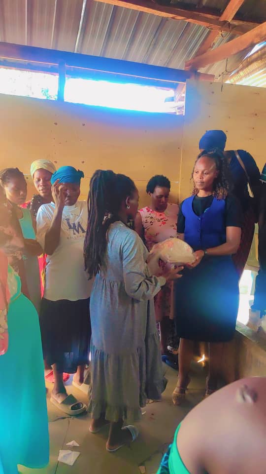 Mothers gathered as supplies are distributed